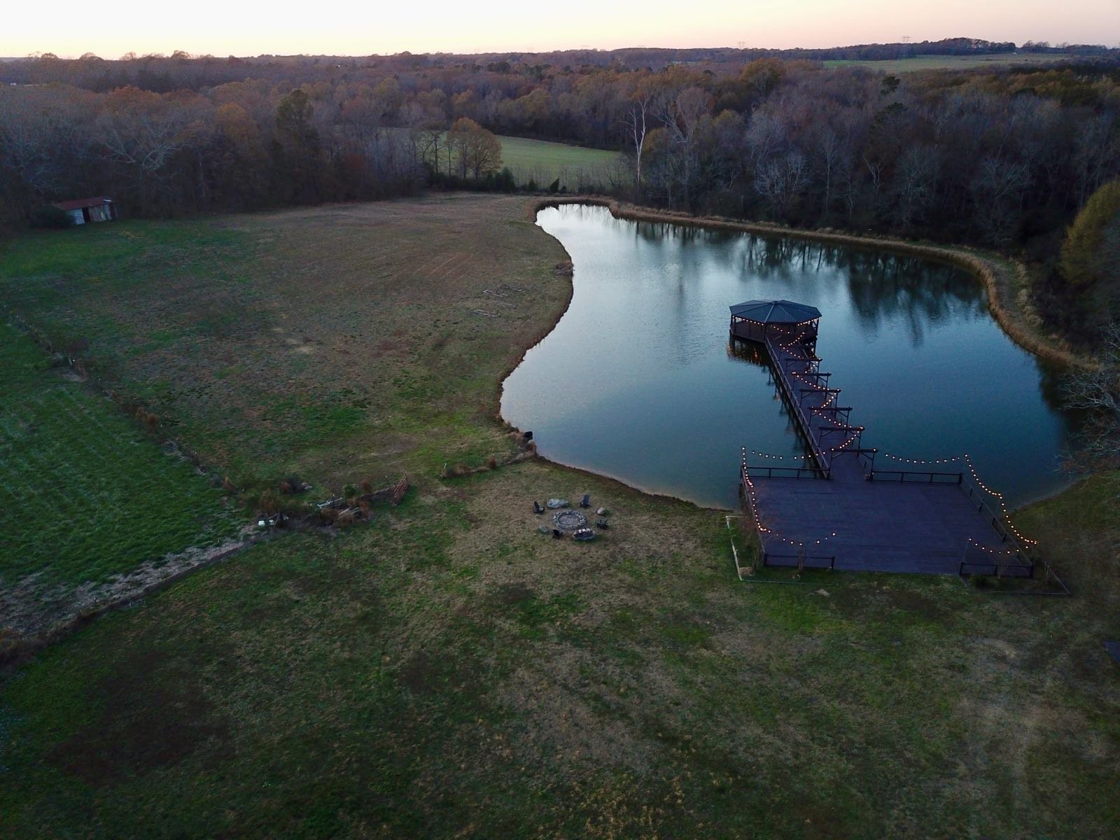 Wicker Branch Farm — pond gazebo and string lights at dusk in Monroe NC